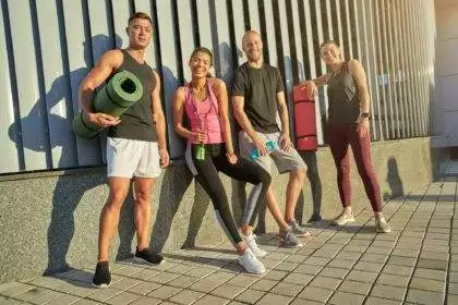 Young multiracial people holding sport equipment